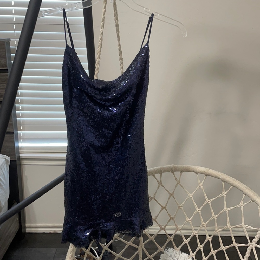 A Mini “Lucy in the sky” dress. It’s never been worn and is a size small